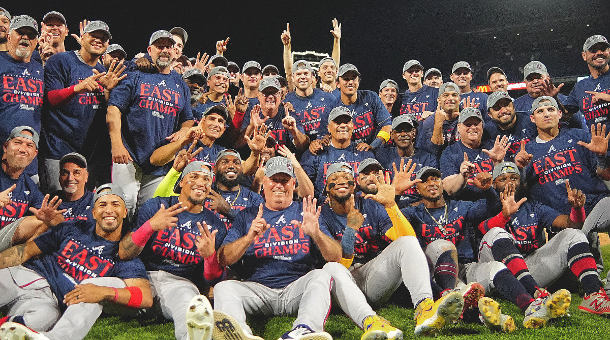 The Braves celebrate after winning the 2023 NL East title.